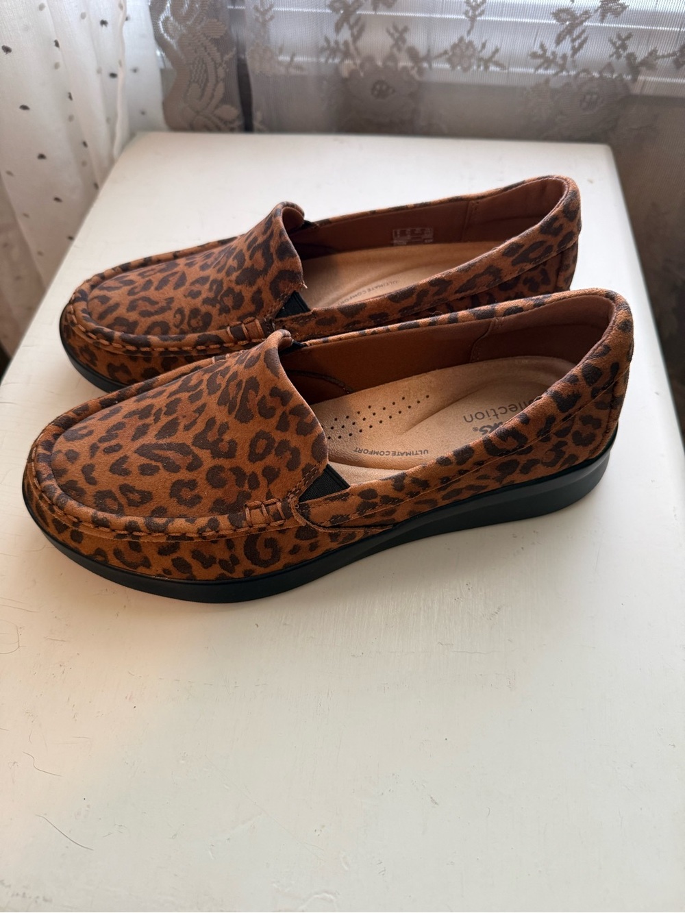 Clarks Leopard Print Slip-On Loafers in Brown and Black